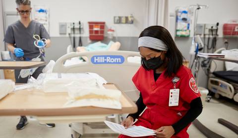 A nursing student reading a document